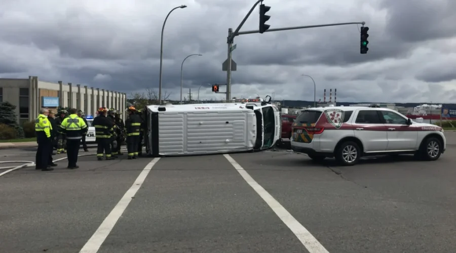 Ambulance Rolls Onto Its Side In Crash