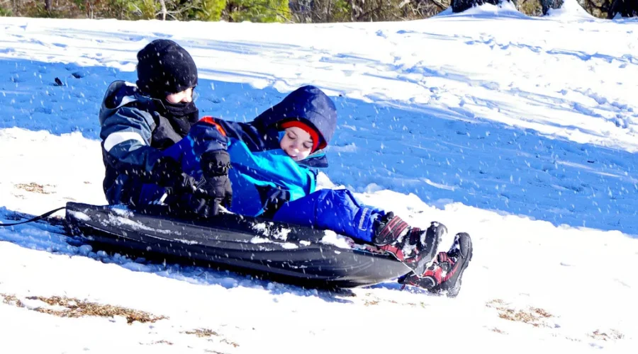 Going sliding with friends playing outside till the daylight ends